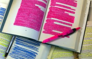 Books' pages highlighted fully with a marker.