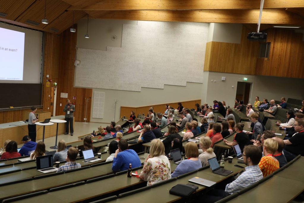 Learning@Aalto guests listening to keynote speakers in Jeti auditorium at AGrid